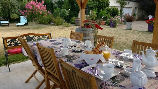 Breakfast in the garden in a guest house
